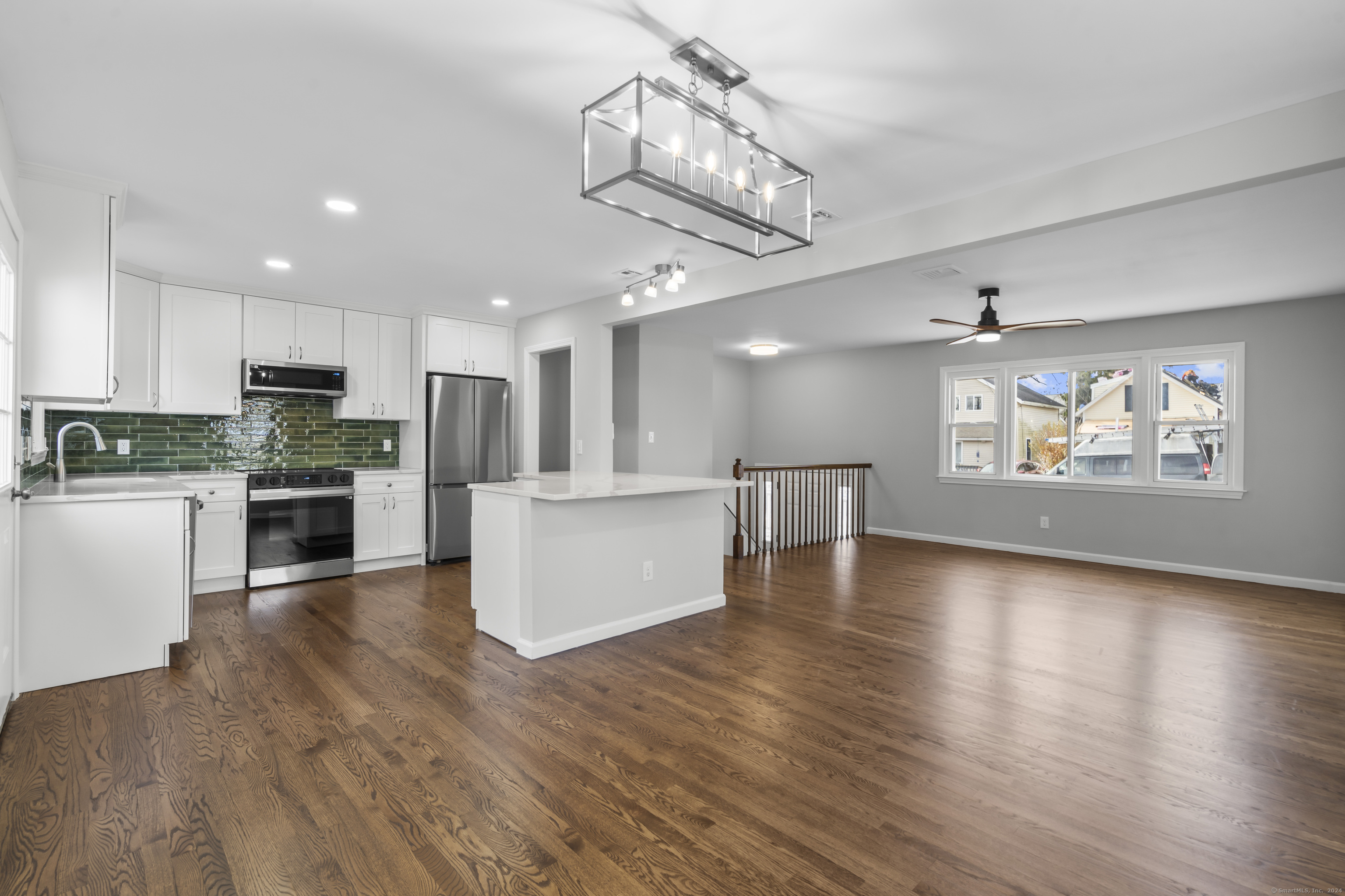 a view of kitchen with cabinets and wooden floor