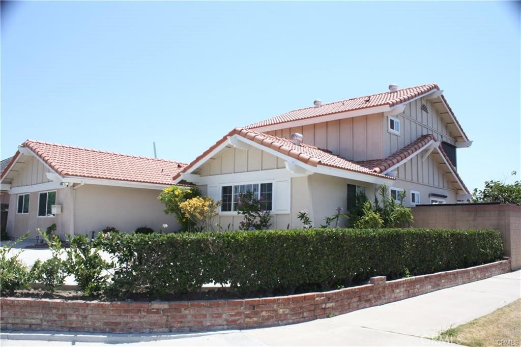 front view of a house with a small yard