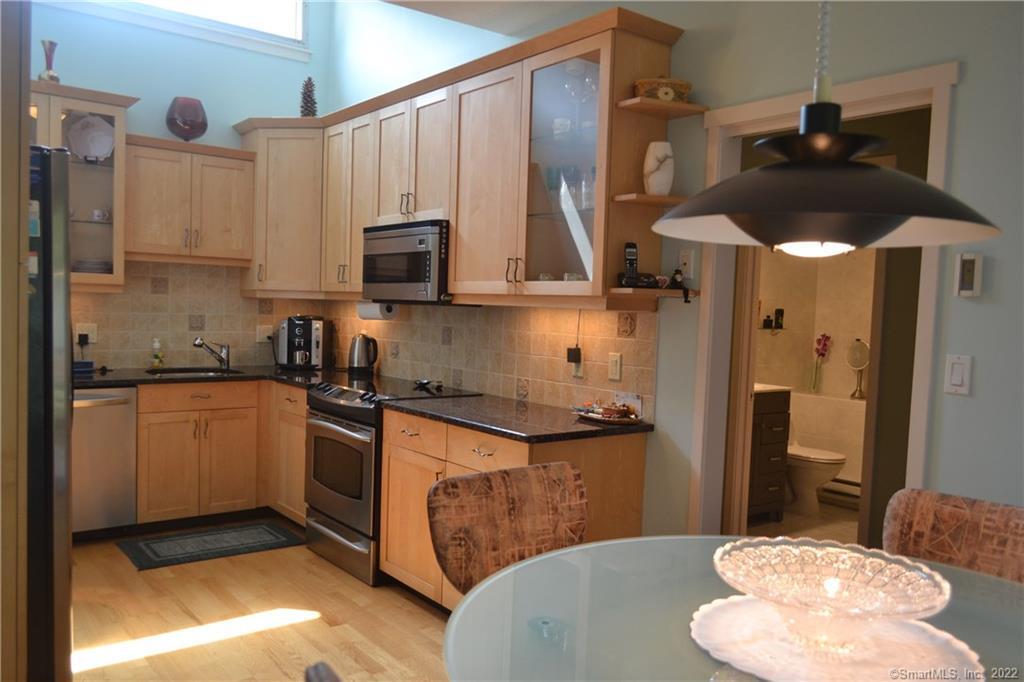 a kitchen with a sink a stove and refrigerator