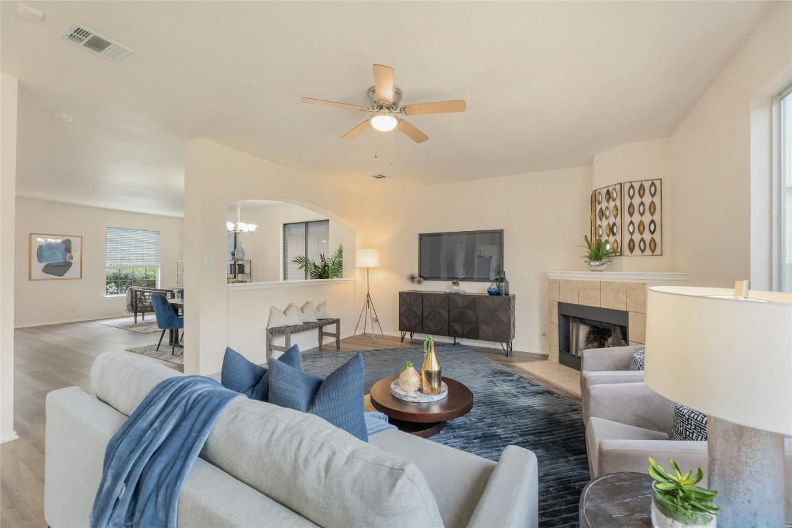 a living room with furniture and a fireplace