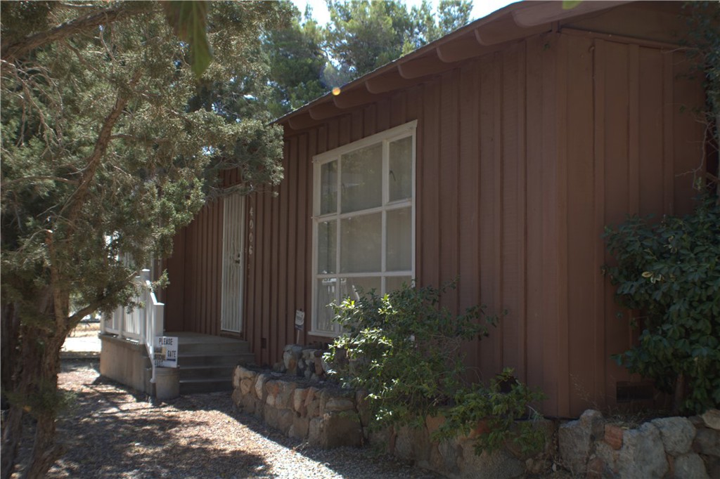 a house with trees in front of it