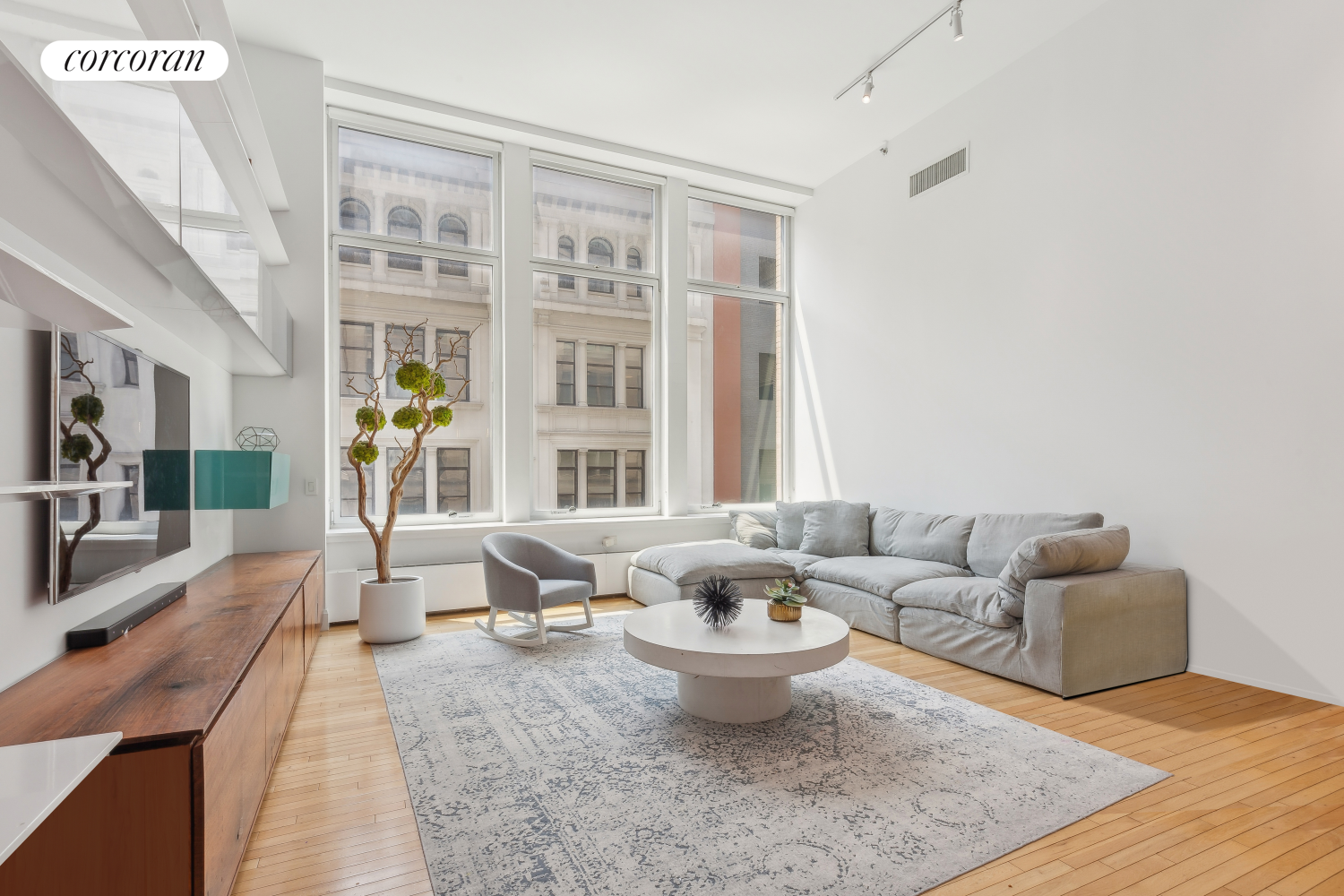 a living room with furniture and a rug