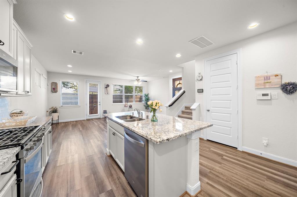 Open Kitchen to Living Room and dining area with windows to Patio