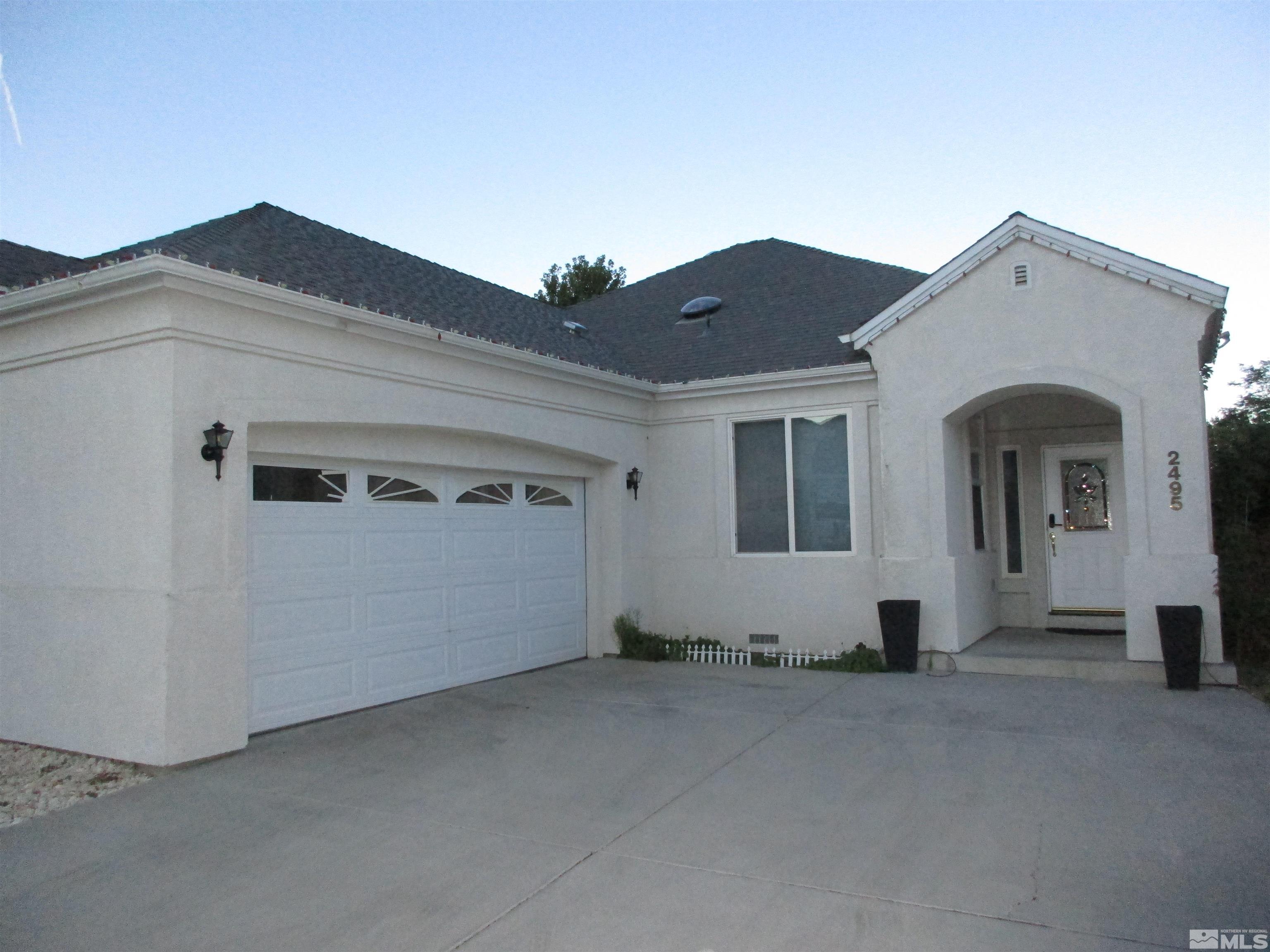 a view of a house with garage