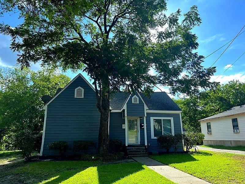 front view of a house with a yard