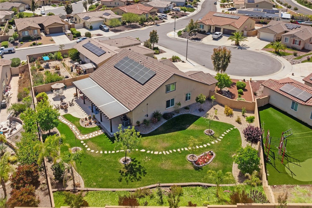 an aerial view of residential houses with outdoor space