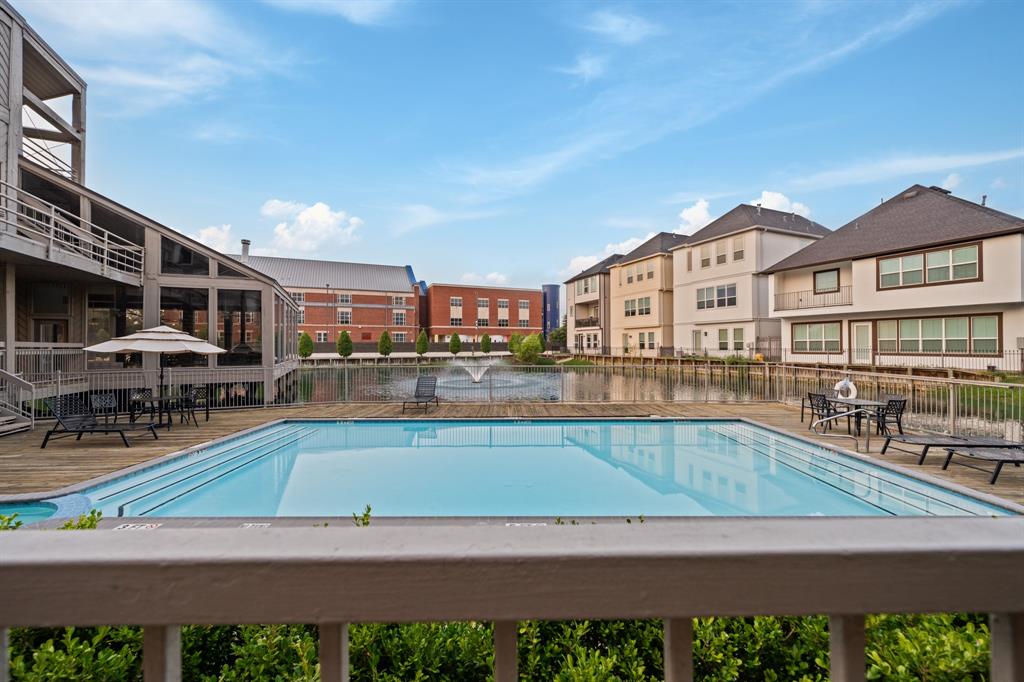 a view of a swimming pool with an outdoor seating