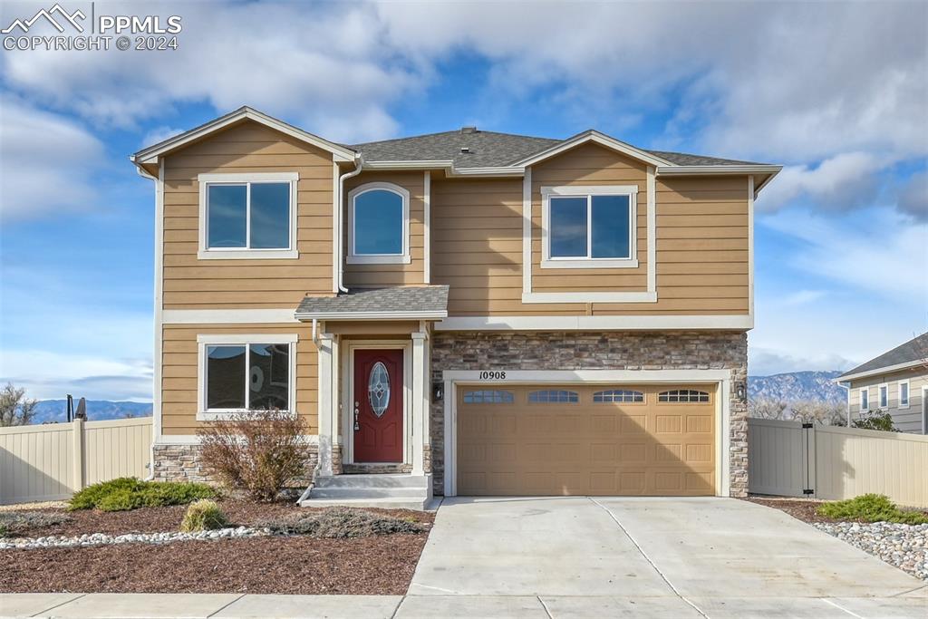 a front view of a house with yard