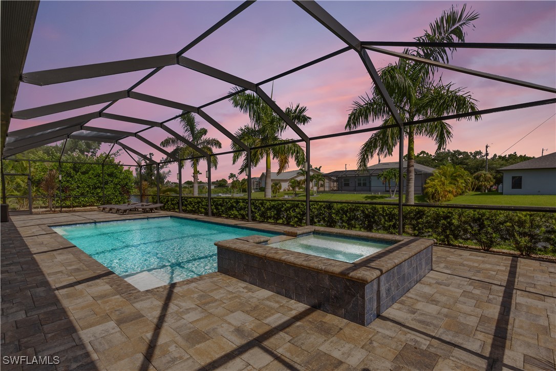 a view of a backyard with sitting area