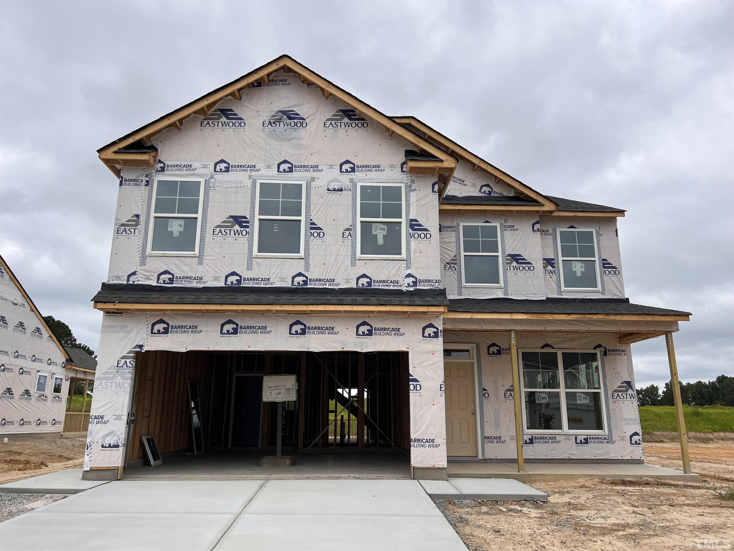 a front view of a house with a garage