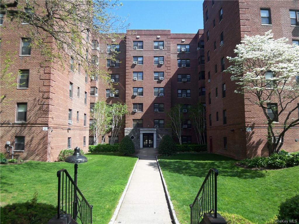 a view of a building with a yard