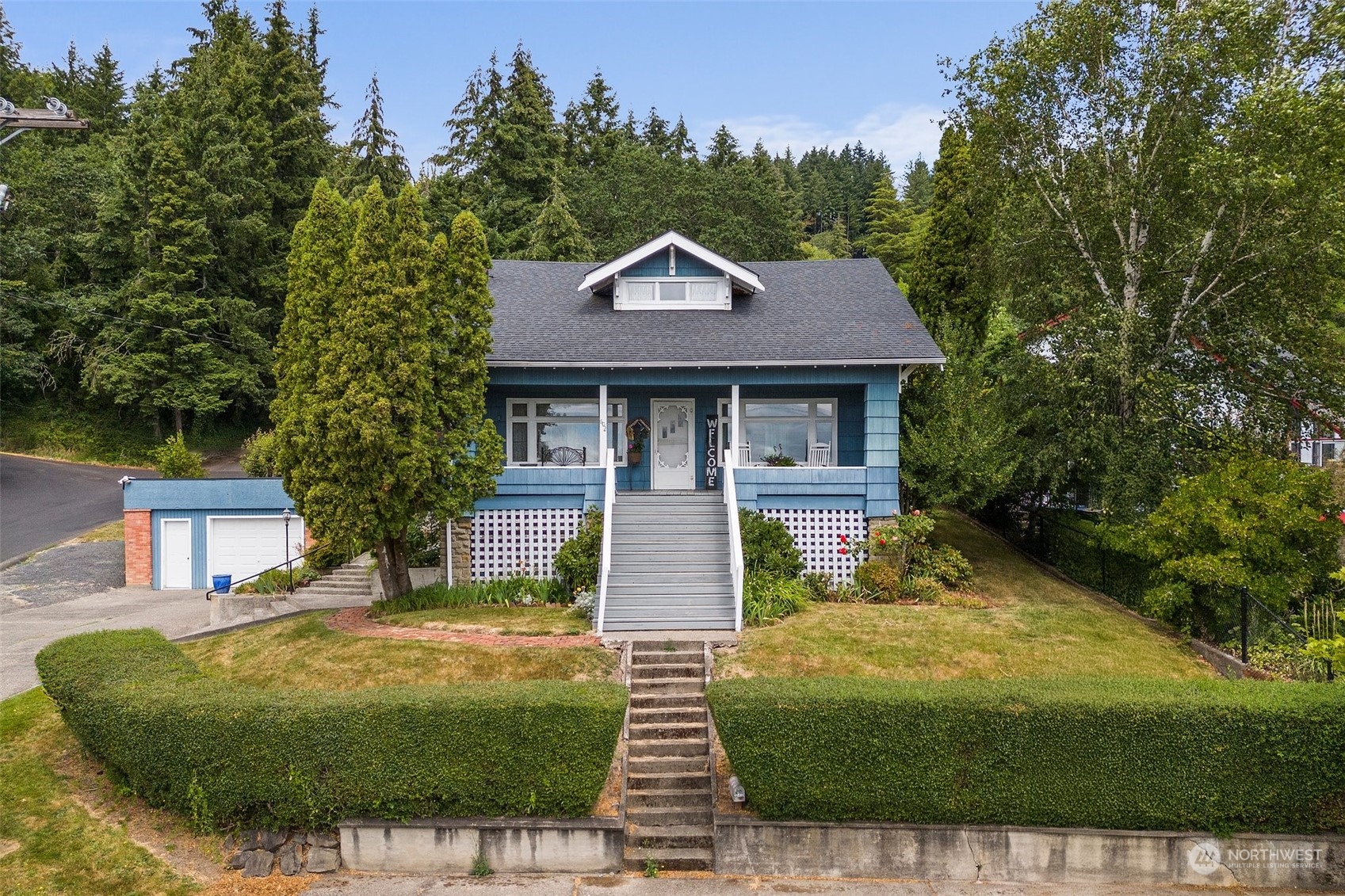 a front view of a house with garden