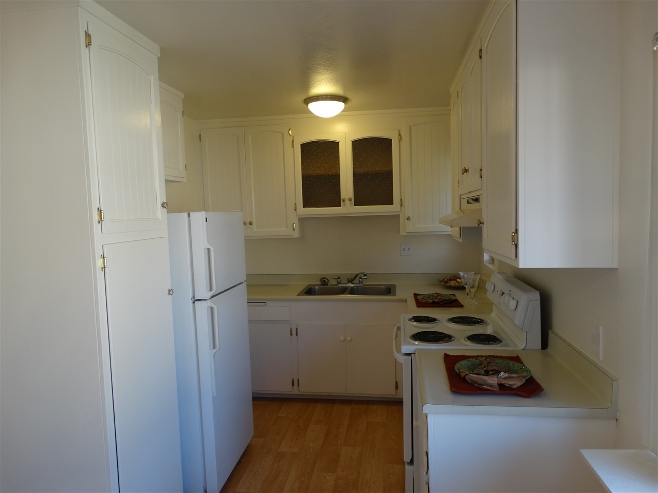 Newer range oven and Refrigerator.