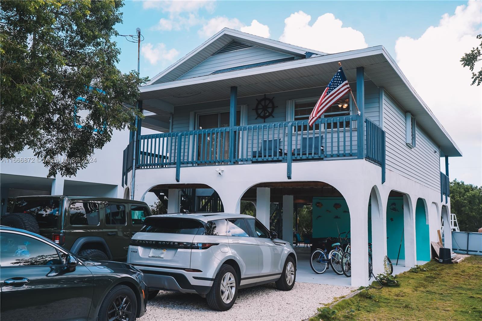 a view of a car park in front of house