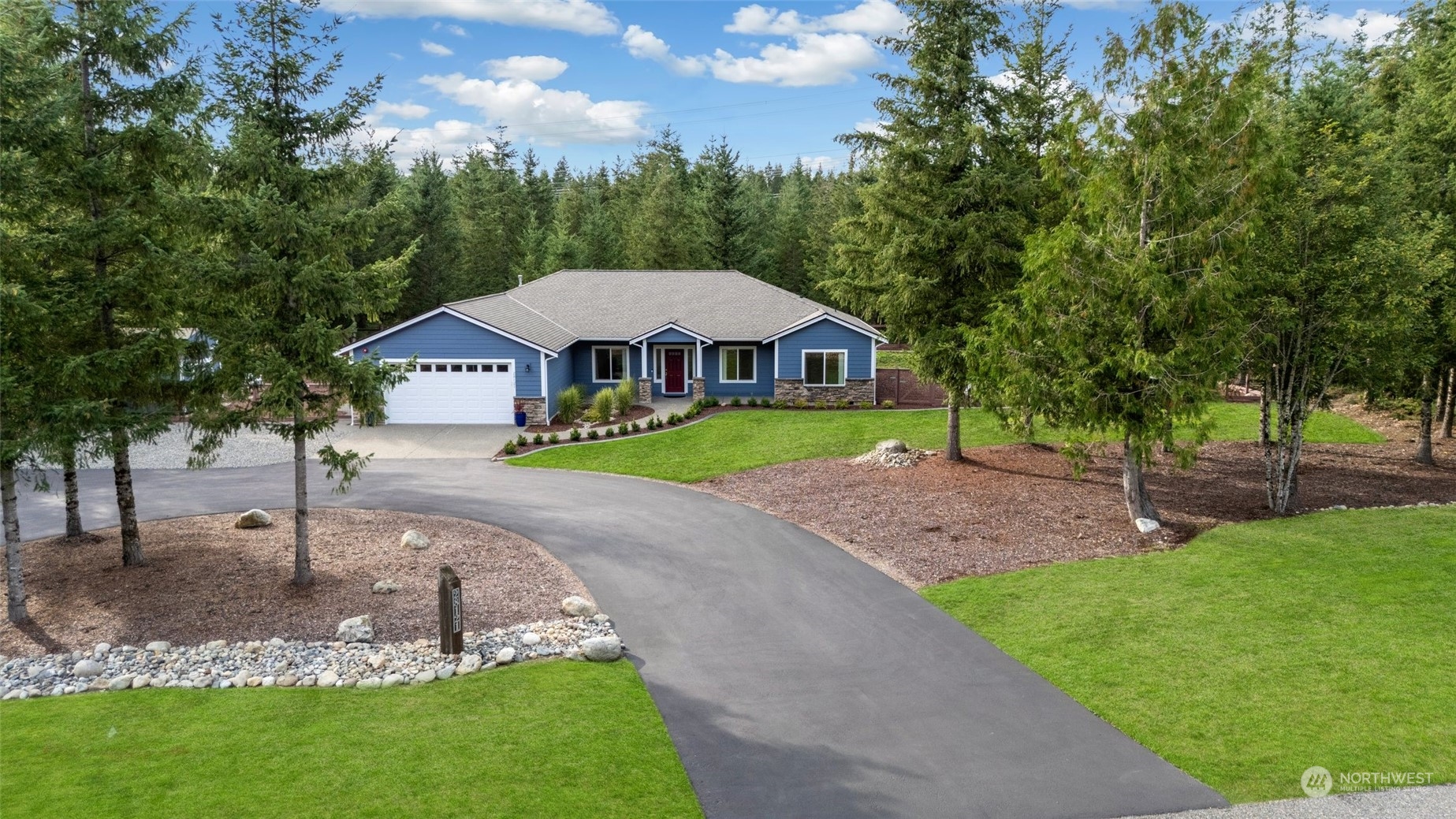 a front view of a house with garden