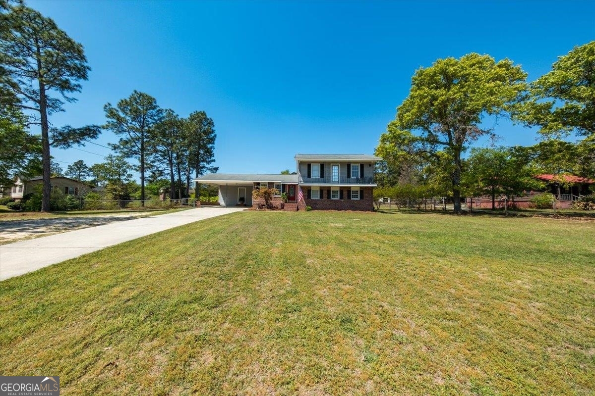 a house view with swimming pool in front of it