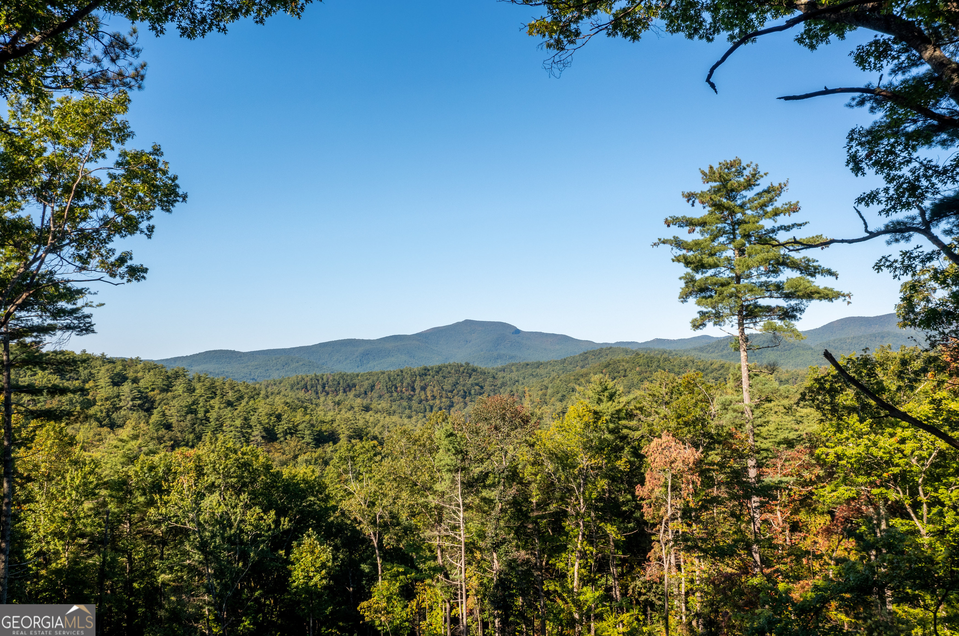 a view of mountain with a lake