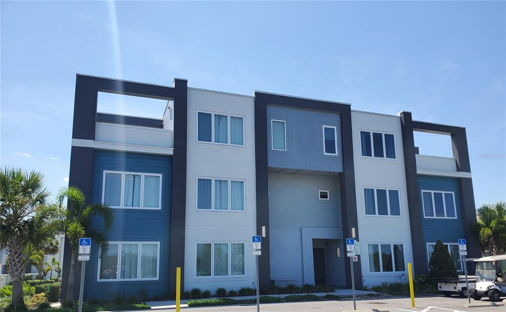 a front view of residential houses with stairs