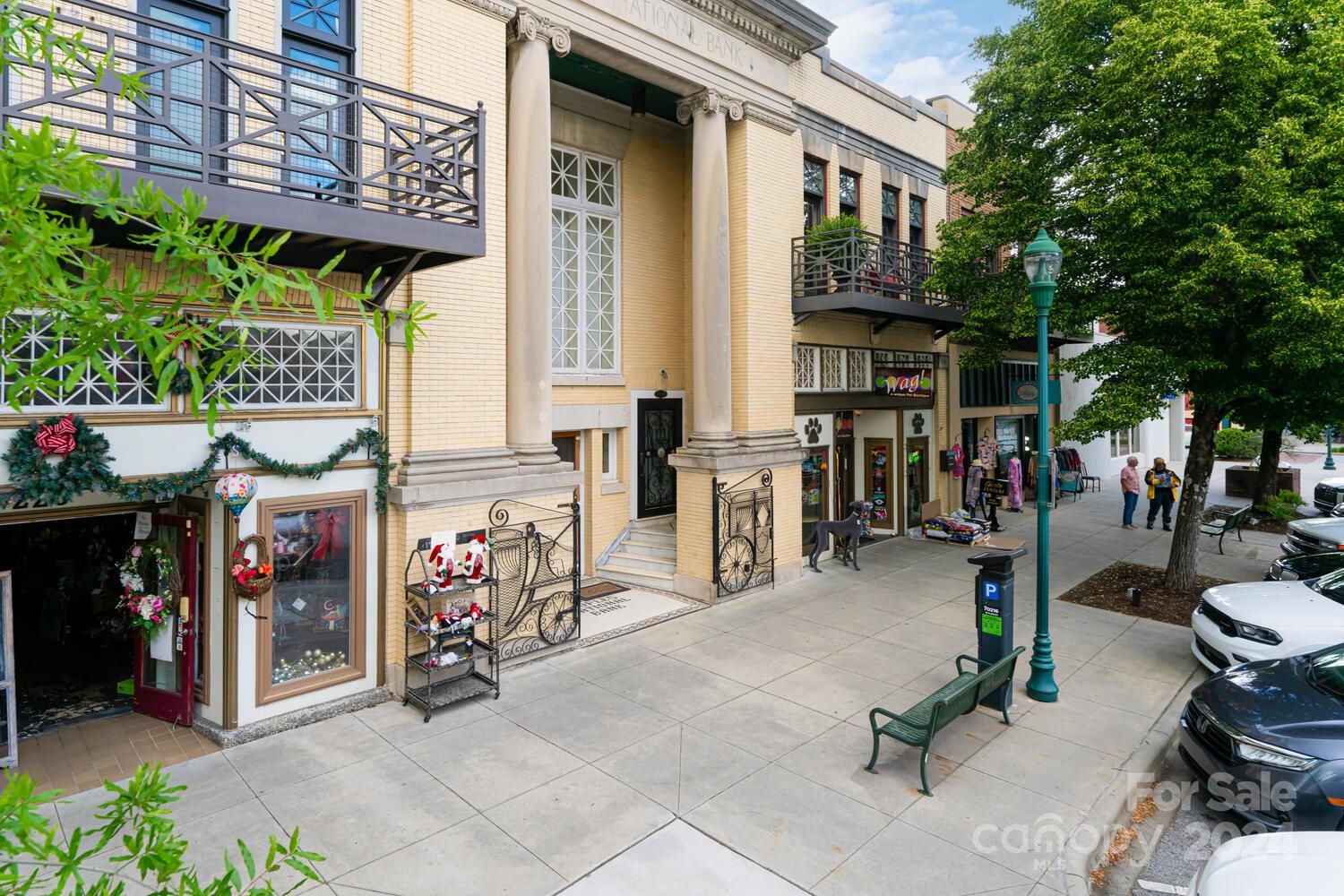 a view of path along with retail shop and buildings