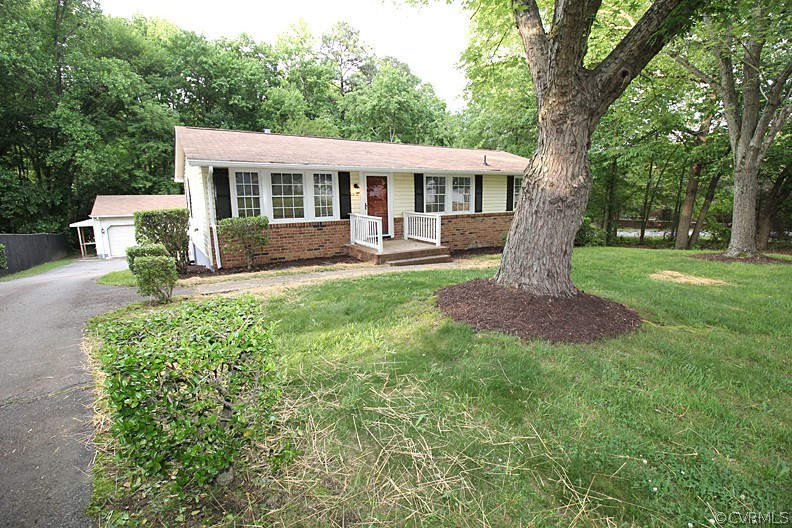 front view of a house with a yard