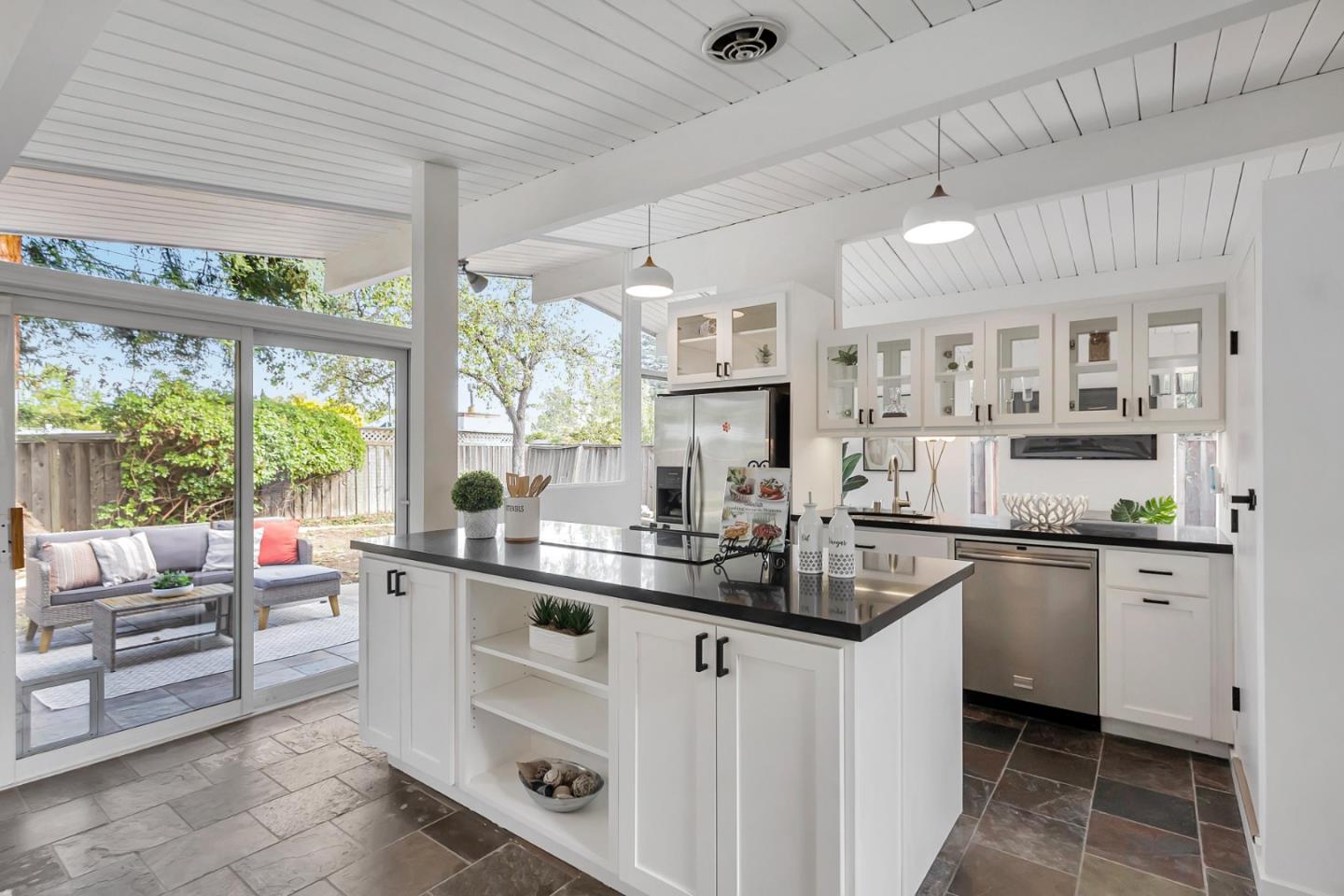 a kitchen with white cabinets and a sink