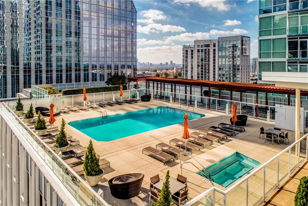 a view of a swimming pool with a patio