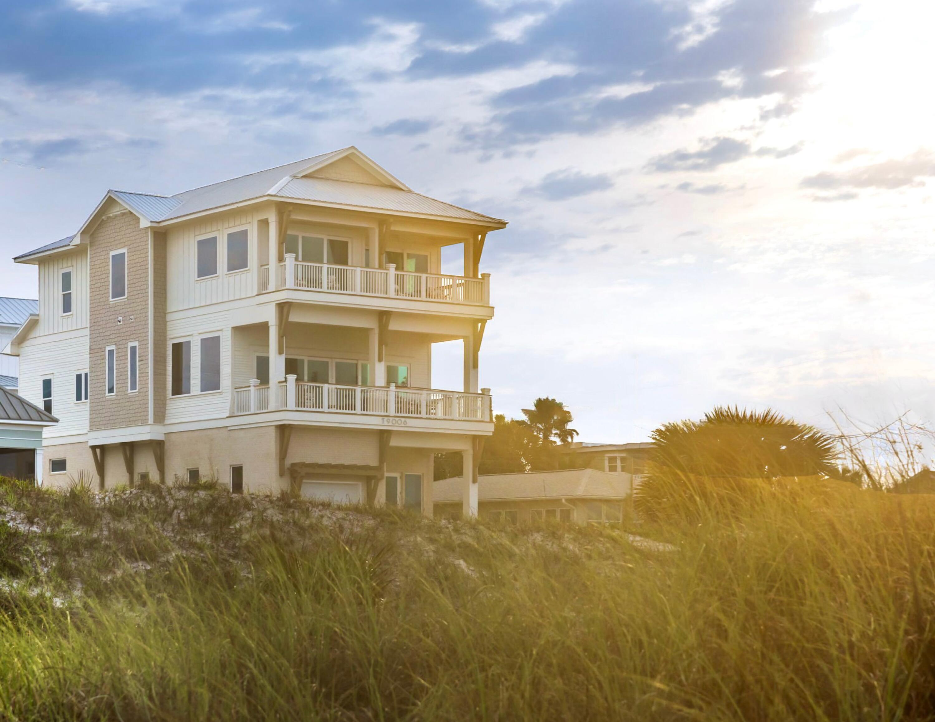 a view of a big building with an ocean