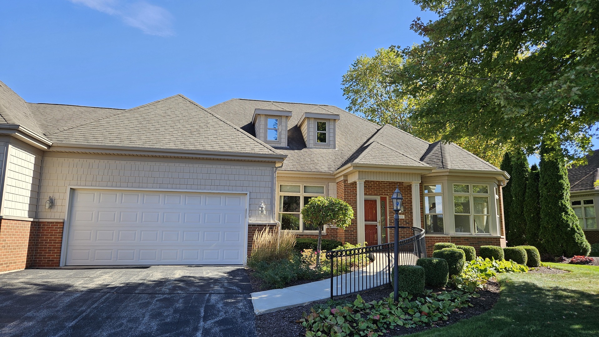 a front view of a house with a yard