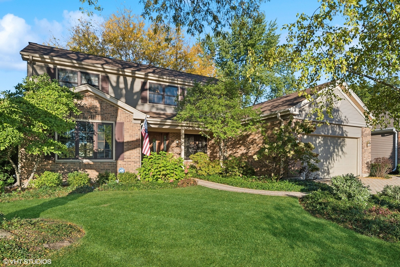 a view of a house with a yard