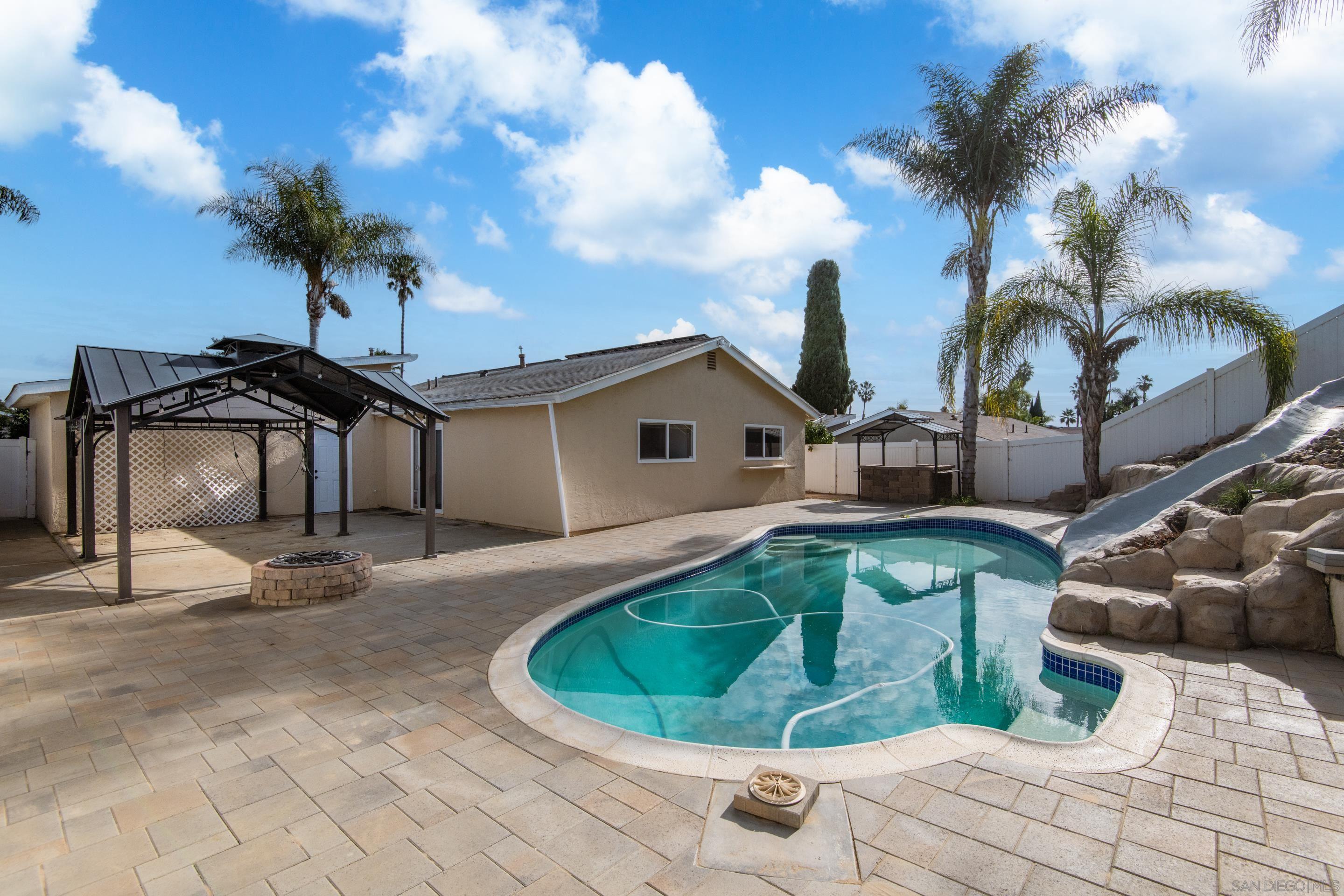 a house view with a backyard space