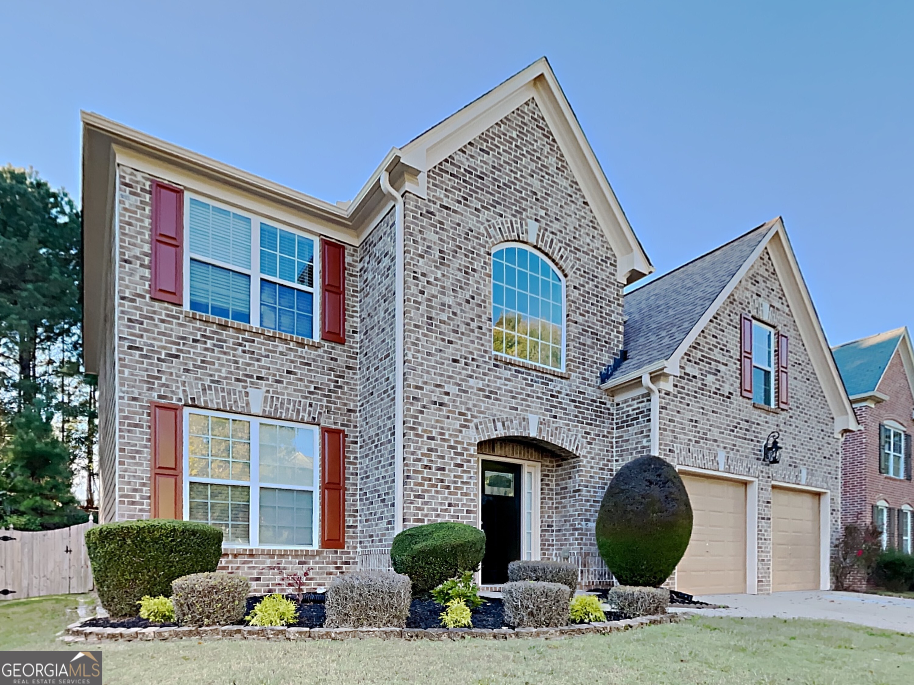 a front view of a house with yard