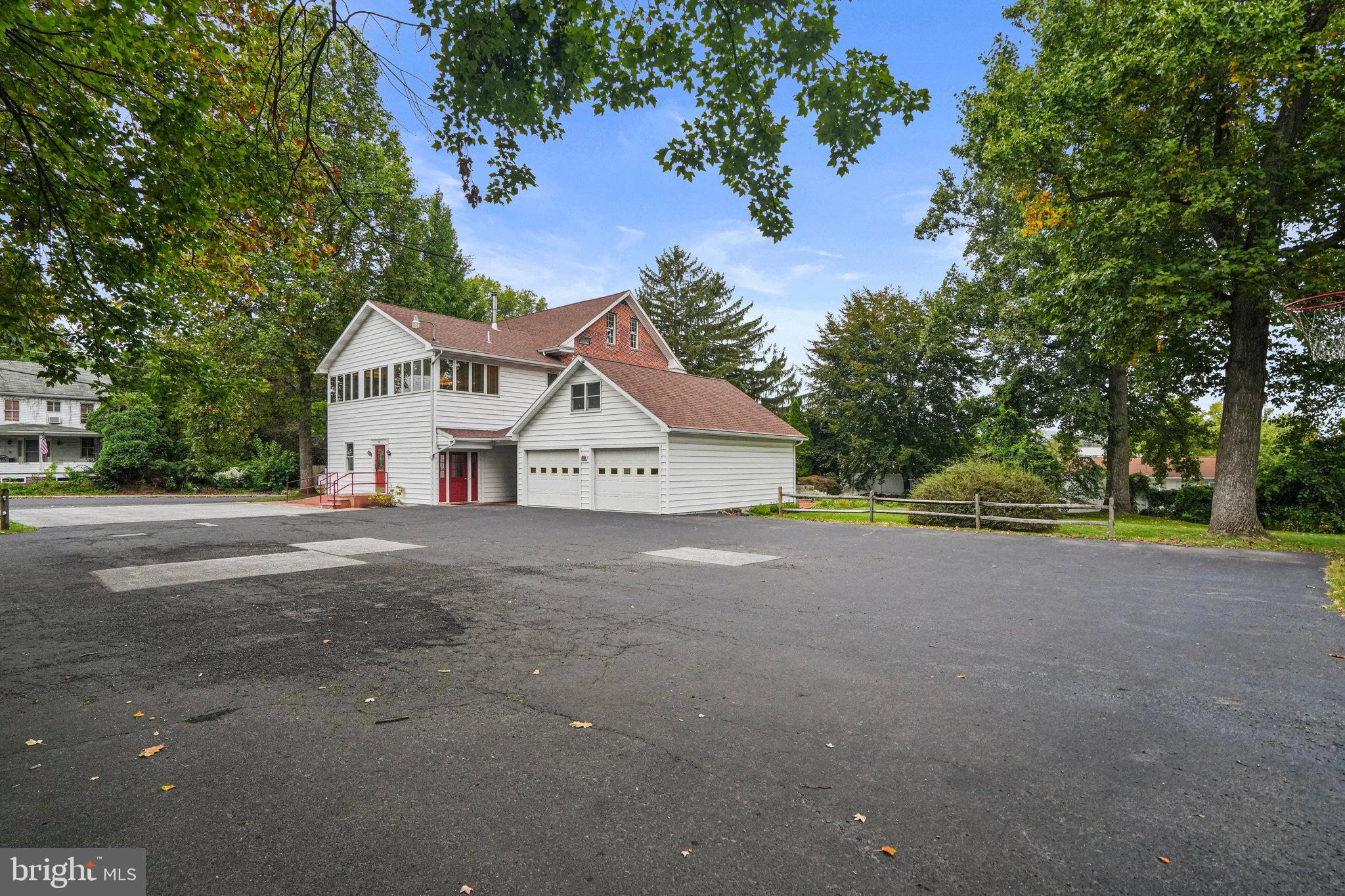 a view of a house with a yard and garage