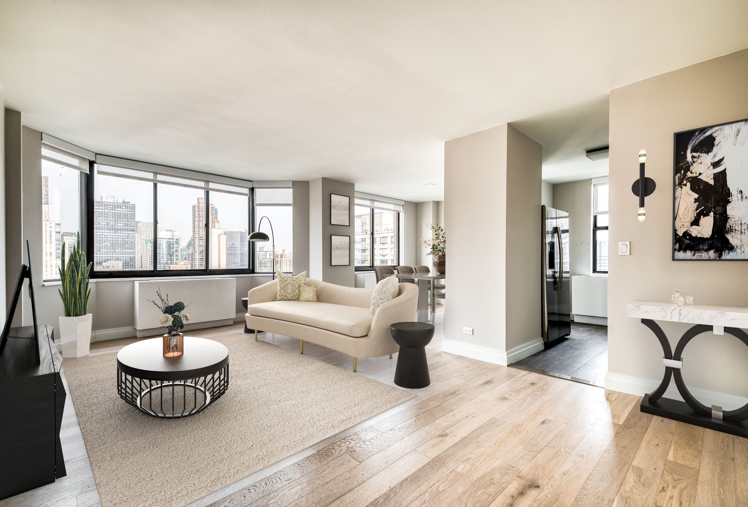 a living room with furniture and a floor to ceiling window