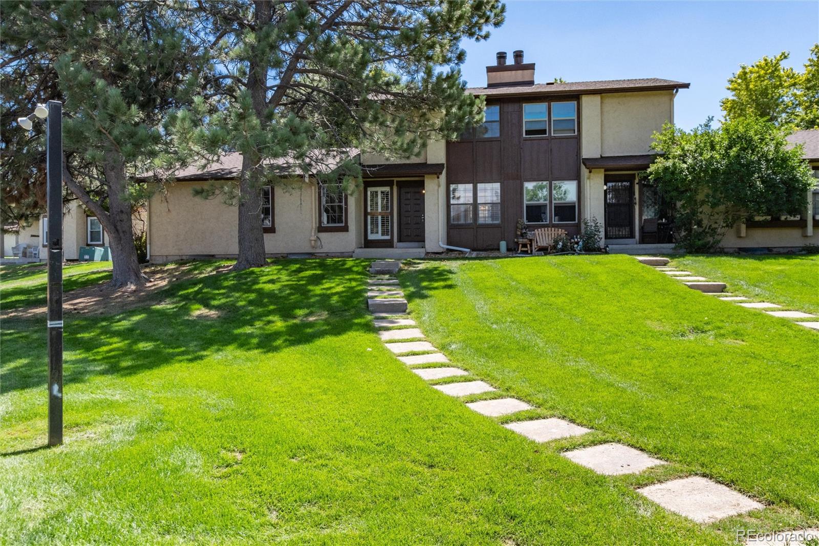 a front view of a house with yard