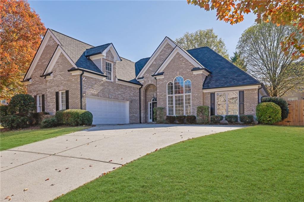 front view of a house with a yard