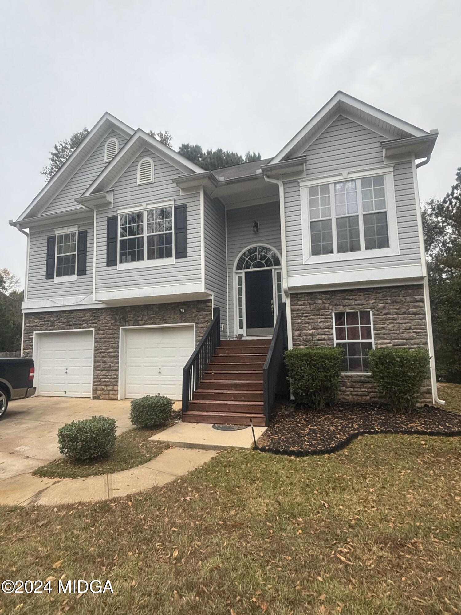 a front view of a house with a yard