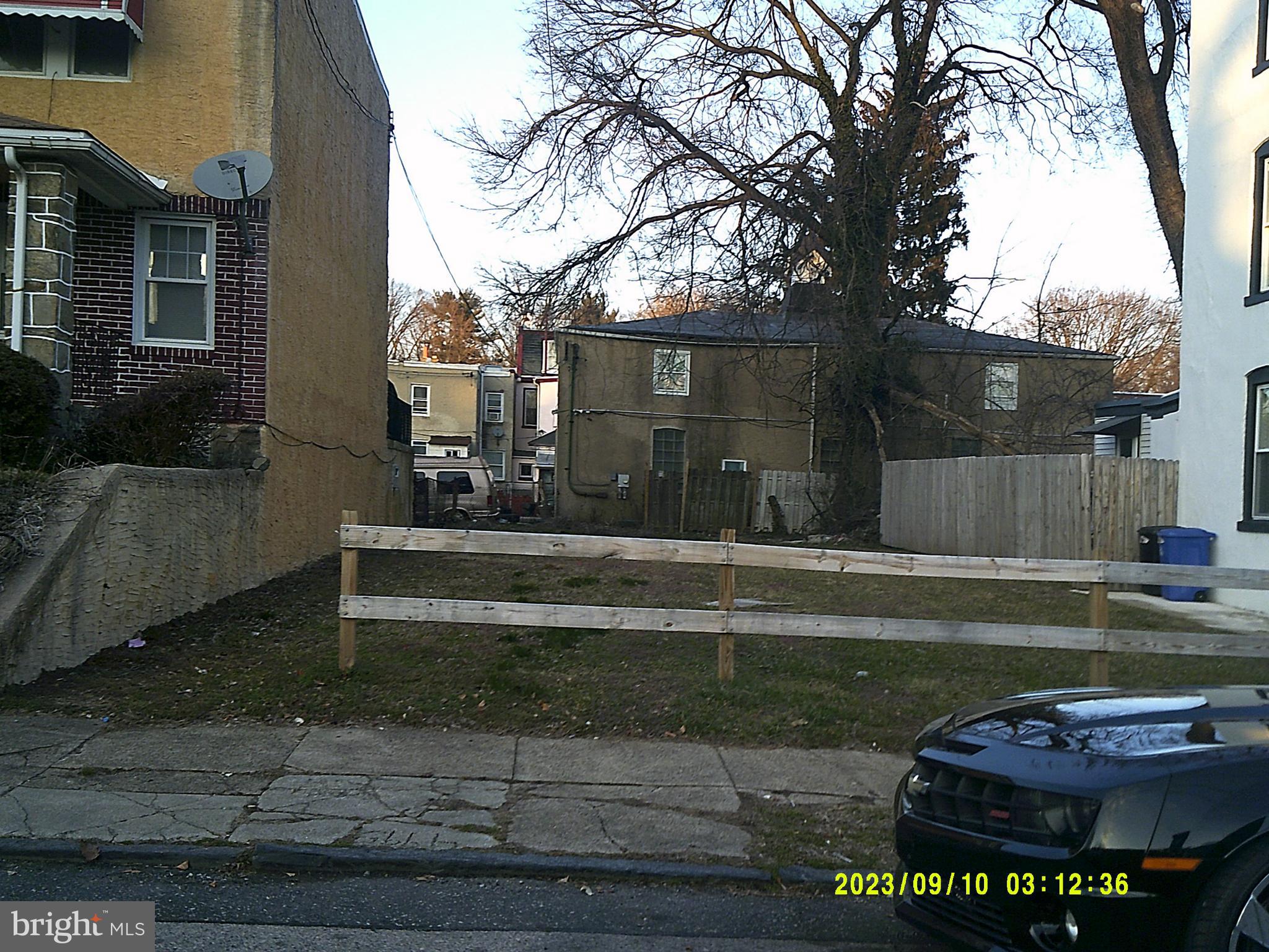 a view of a back yard of the house and a fountain