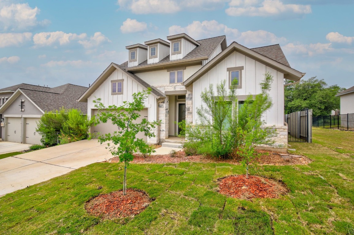 a front view of a house with garden