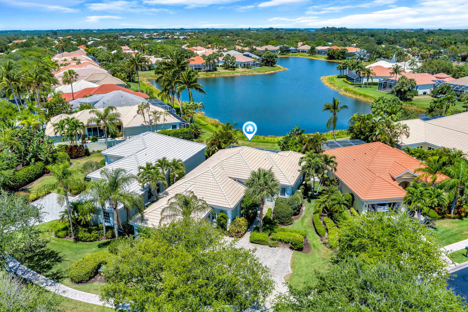 an aerial view of residential houses with outdoor space and river