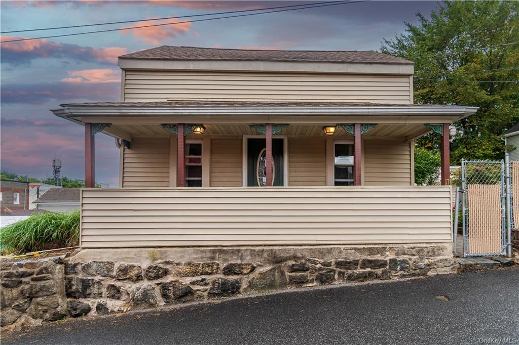 Farmhouse featuring a porch