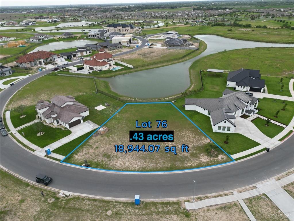 an aerial view of a house with outdoor space swimming pool and ocean view