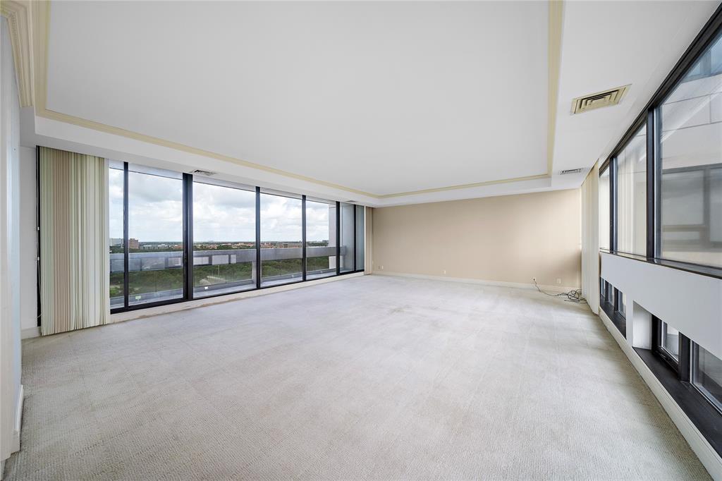 a view of an empty room with a balcony