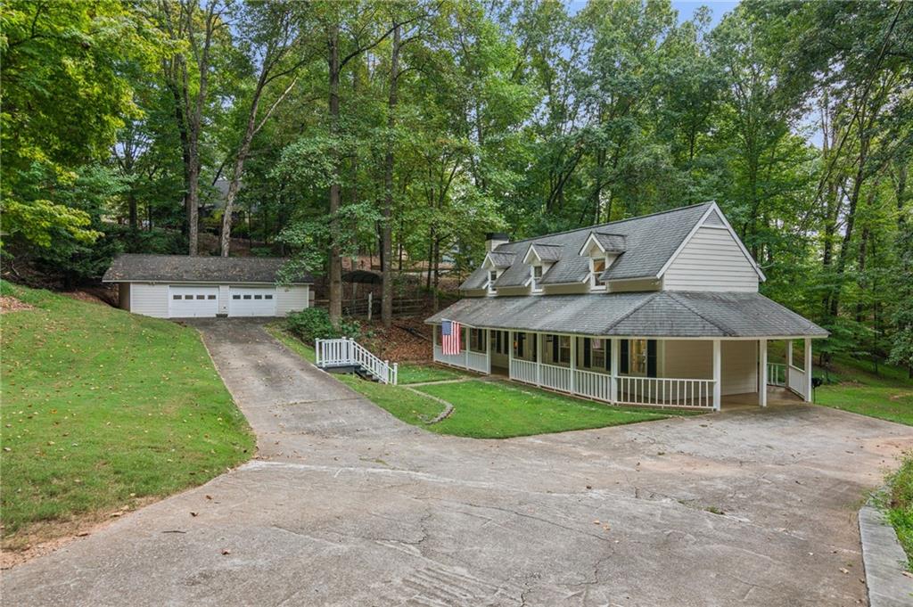 a view of a house with a yard