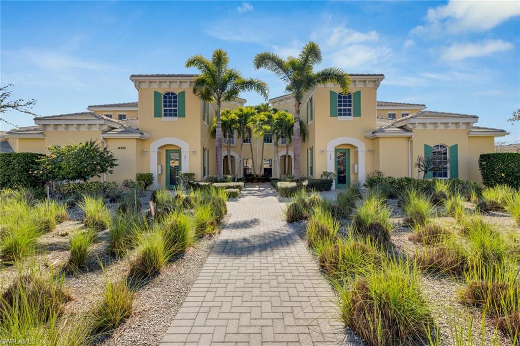 a front view of a house with a garden