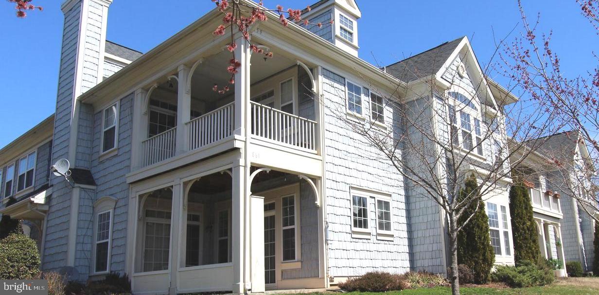 a view of a house with a door and balcony