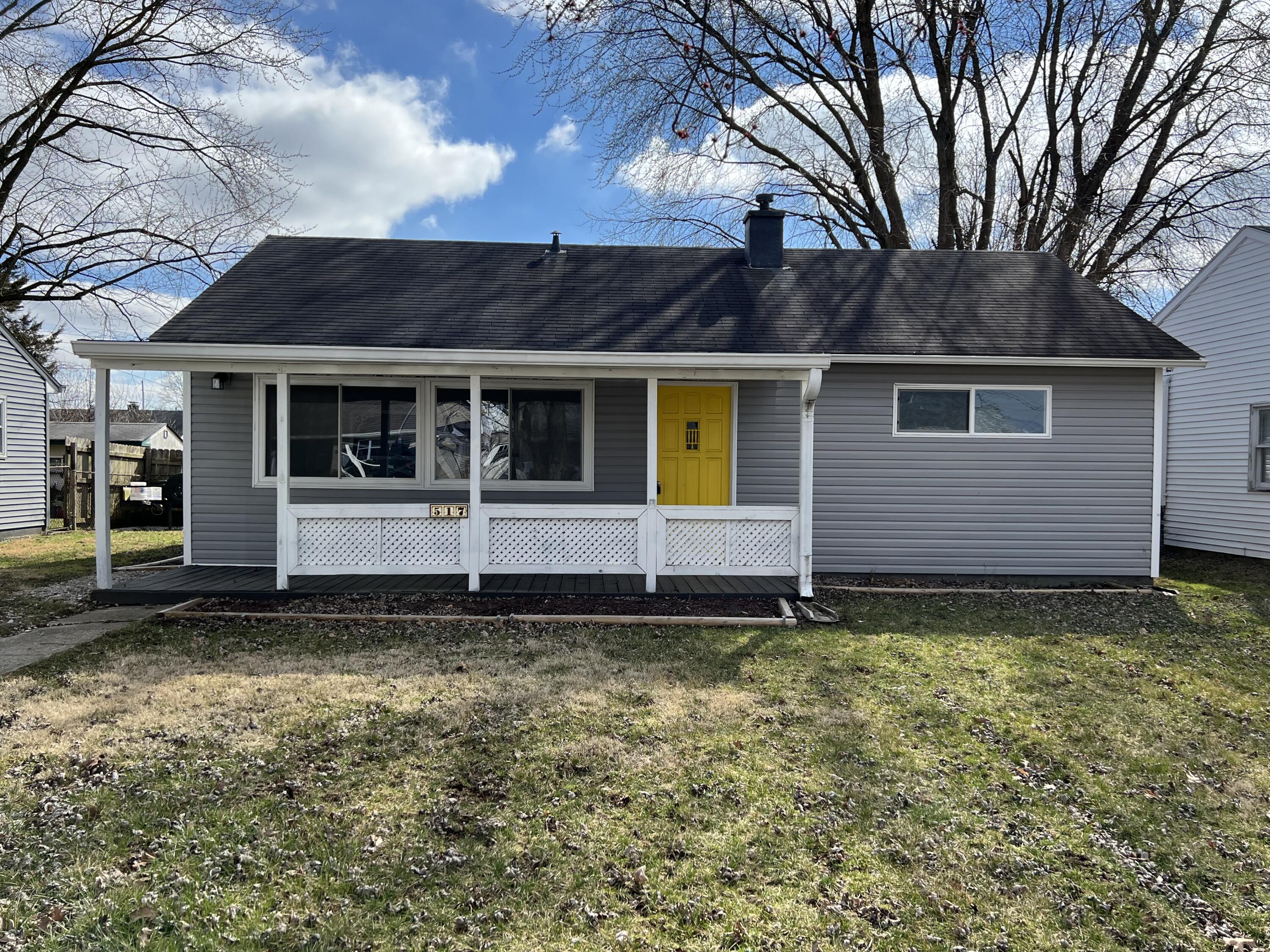 a house with trees in the background