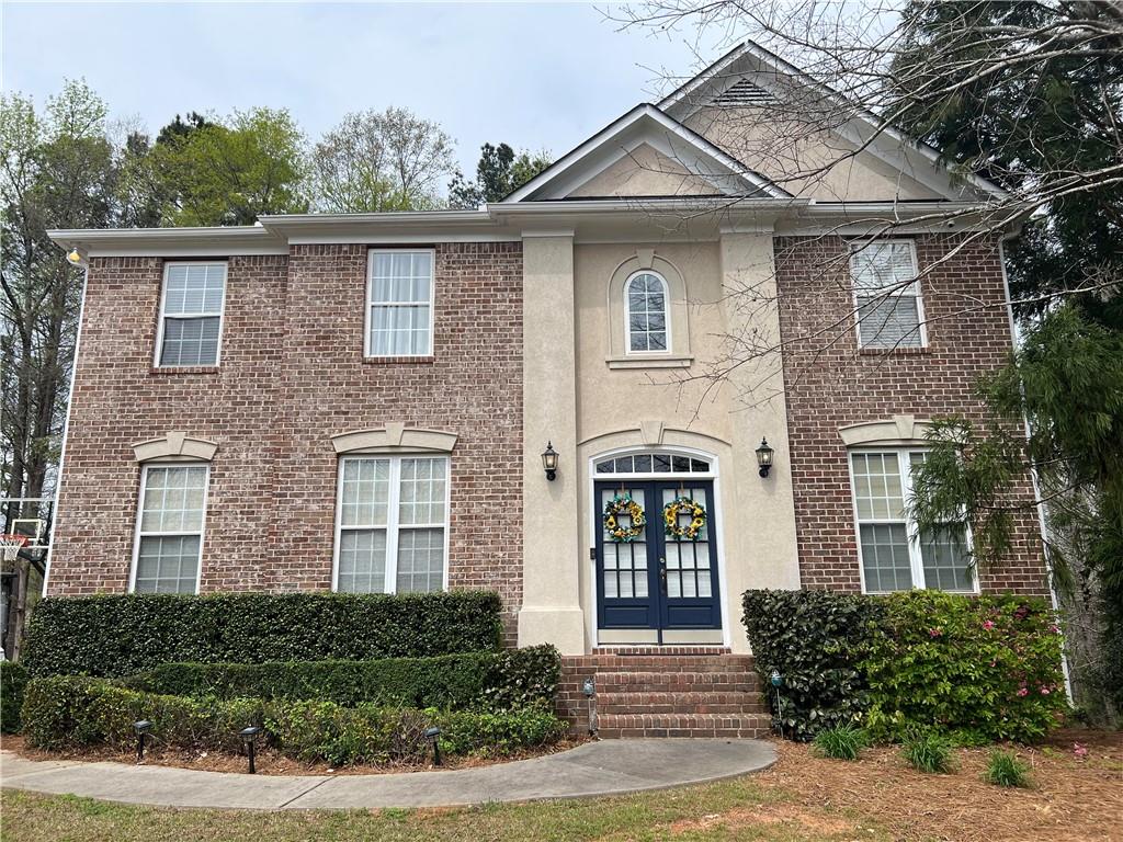 front view of a house with a yard