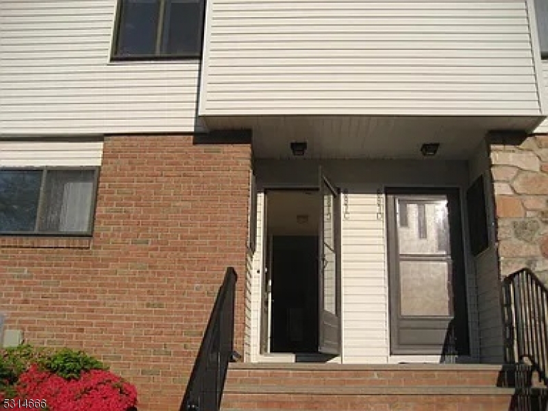 a view of a house with a potted plant