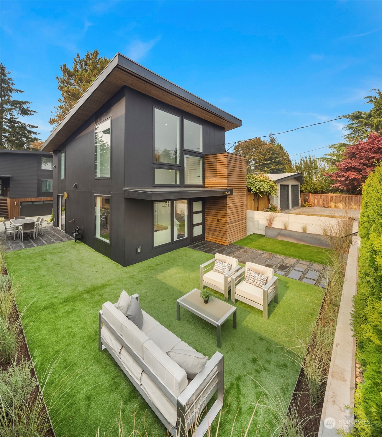 a view of a house with a yard porch and sitting area