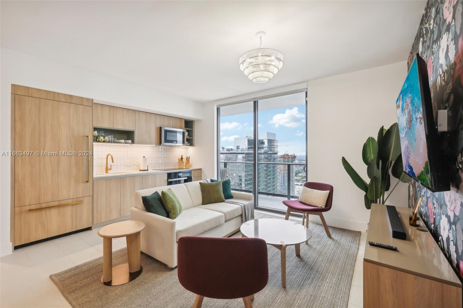 a living room with furniture a large window and a flat screen tv